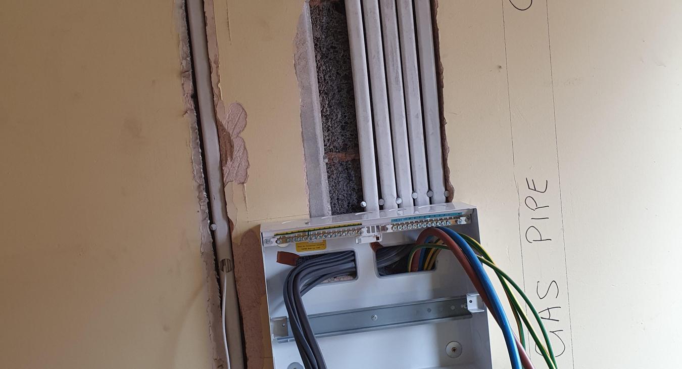 new fuse box being installed during rewire