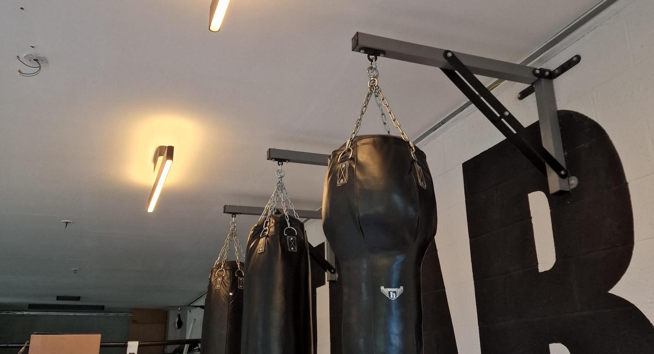 Lighting installation over punch bags